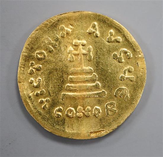 A Byzantine histamenon gold coin.